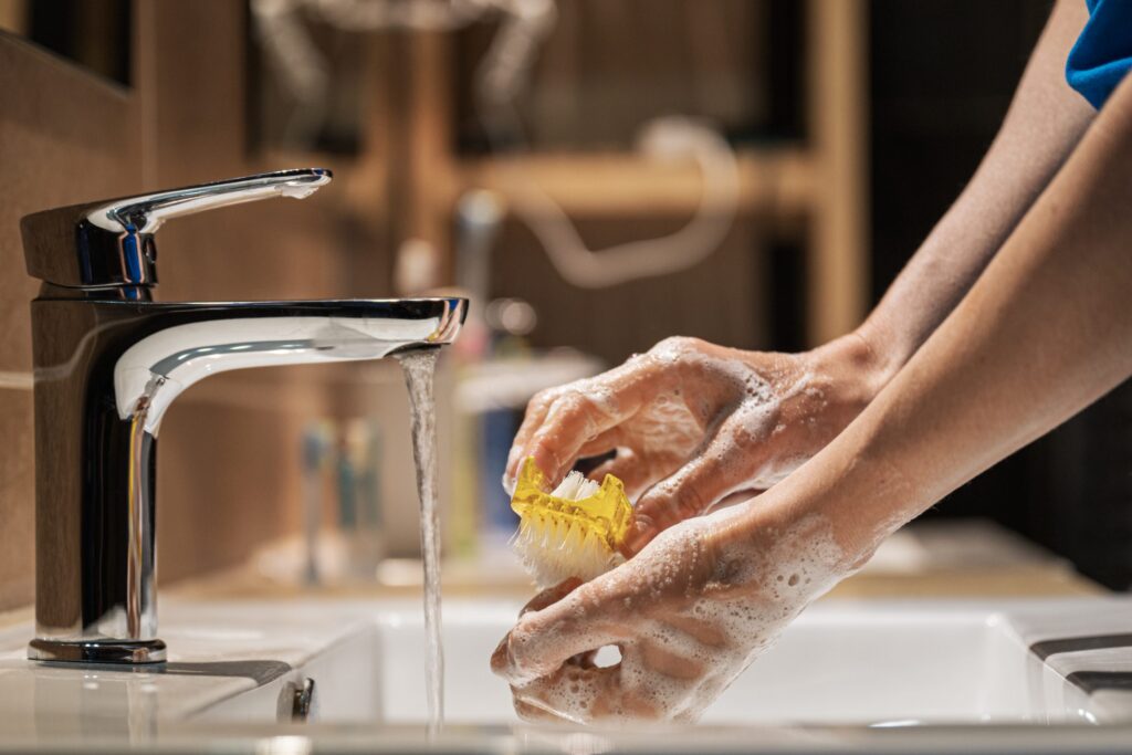 closeup view of a woman washing her hands with so utc scaled