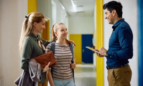 happy-teacher-talking-to-high-school-student-and-h-2024-12-13-17-10-32-utc-1024x683-1