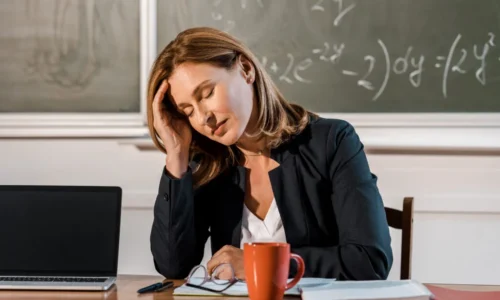 tired-female-teacher-with-eyes-closed-sitting-at-c-2024-11-17-13-12-20-utc-1024x683-1