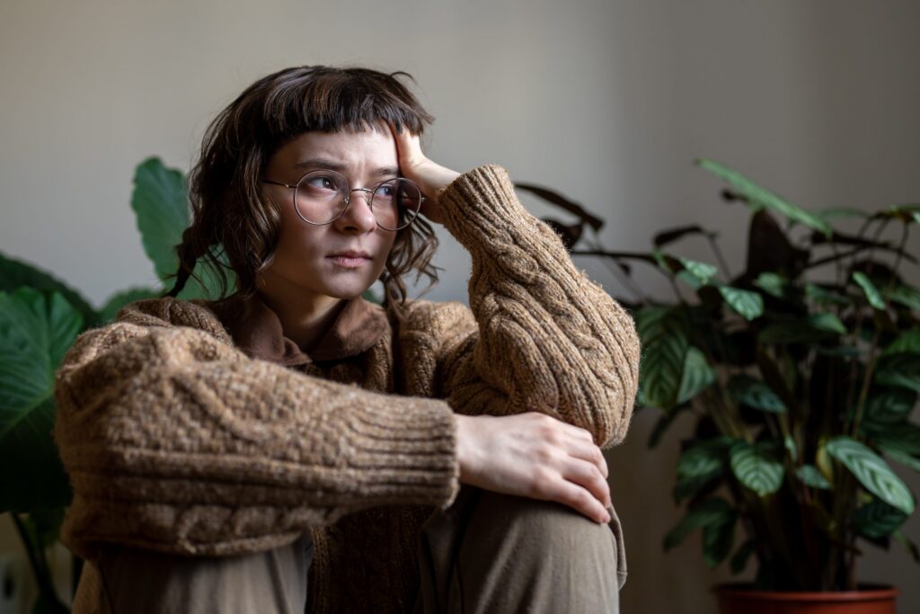 upset desperate teen girl sitting alone at home wi utc scaled