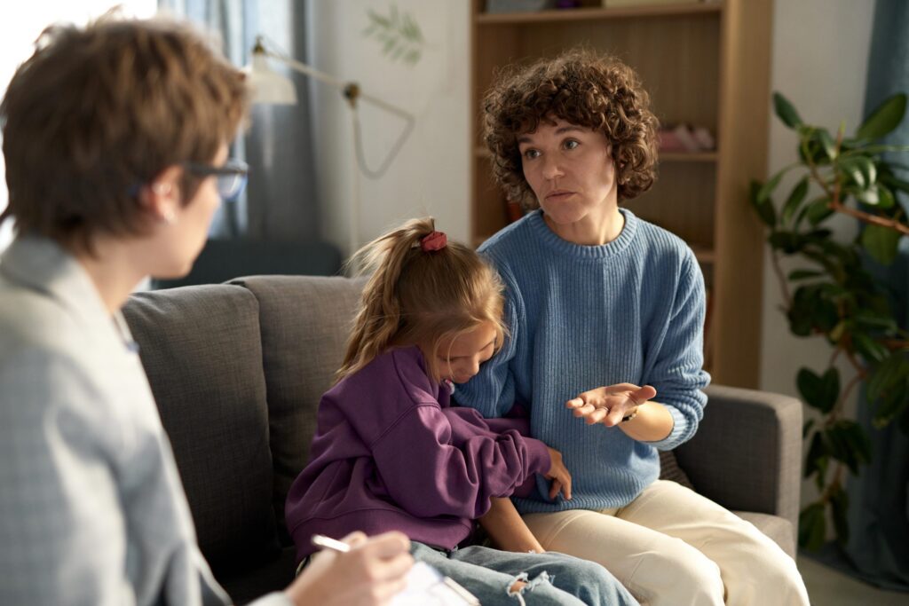 woman talking to child psychologist at home utc scaled