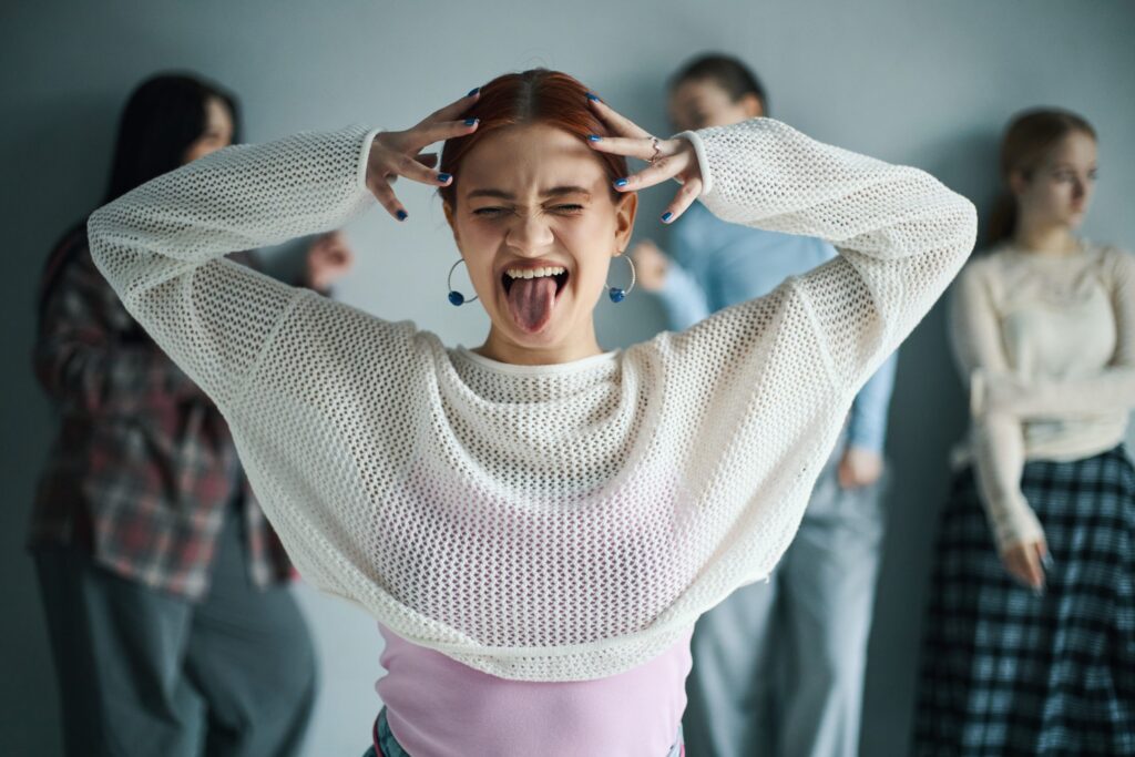 young woman having fun and making funny face gestu utc scaled