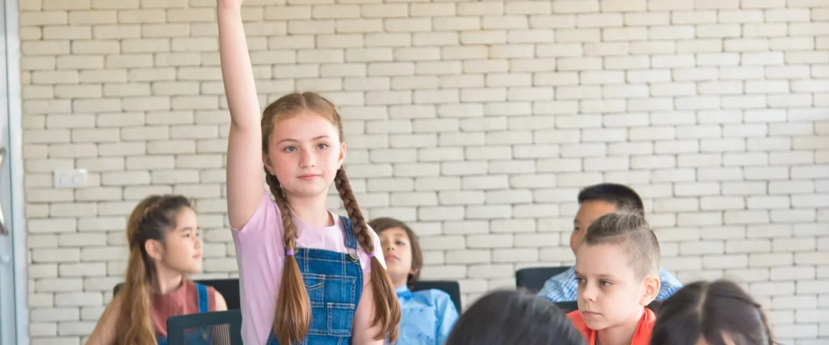 elementary-school-female-students-stand-and-raise-2025-01-08-14-25-03-utc-2048x1468